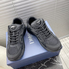 Dior unisex sneakers in dark gray with lace-up front and padded collar.