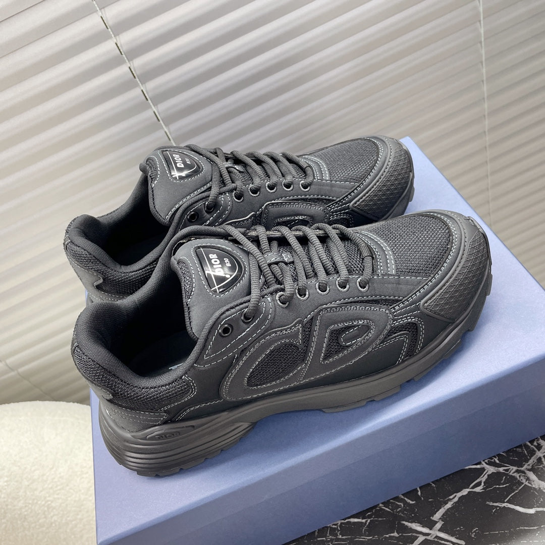 Dior unisex sneakers dark gray, top view showing laces, eyelets, and logo tongue.