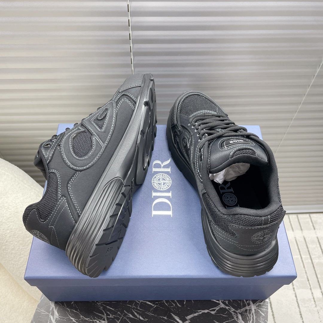 Dior unisex sneakers, angled view, dark gray with side logos and lace-up.