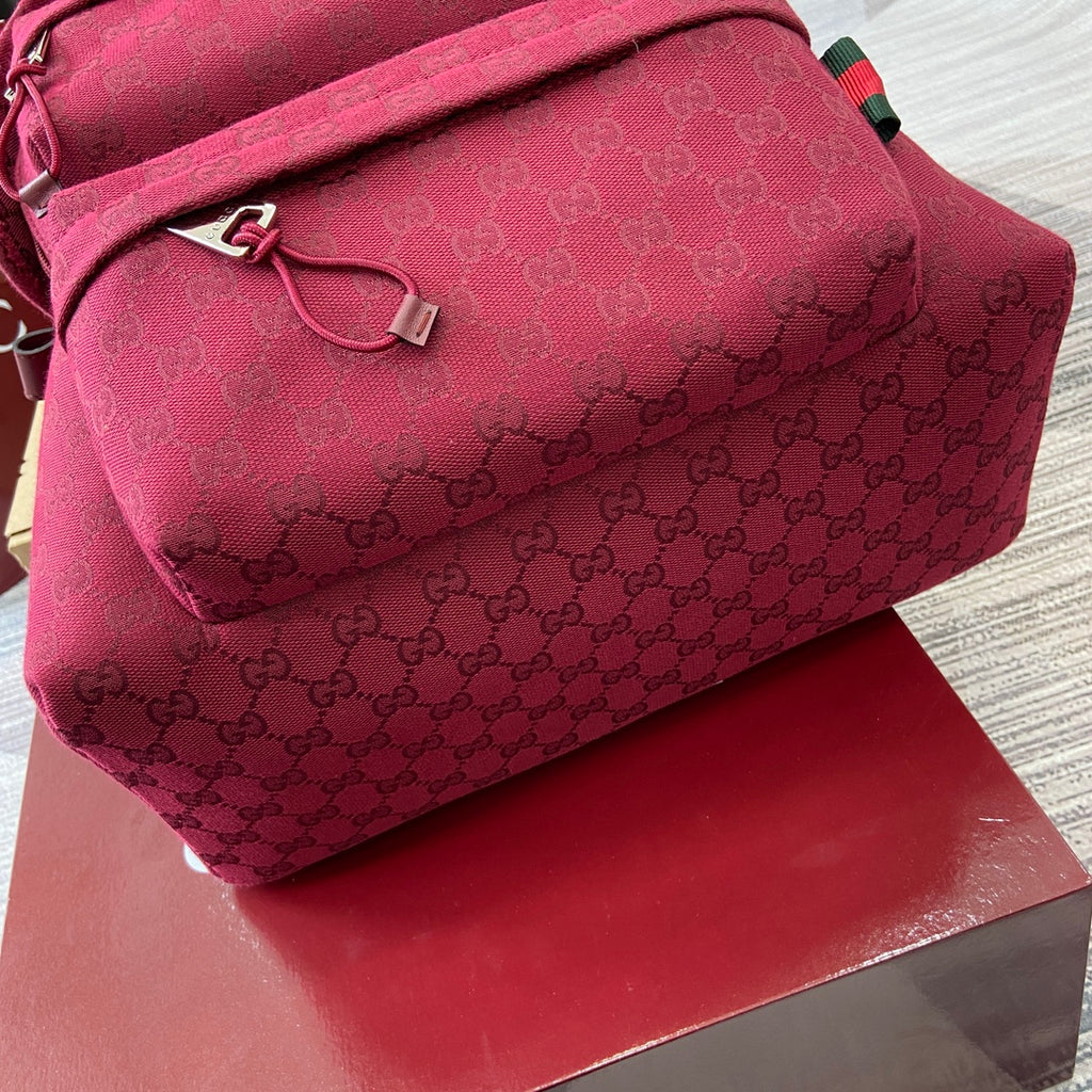 Gucci mini backpack burgundy with GG monogram, top handle strap and front zip pull