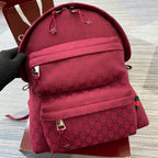 Gucci mini backpack in burgundy with GG monogram, top drawstring, and front zip pocket