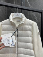 Moncler padded jacket close-up, light white quilted front with zipper and collar