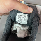 Balenciaga unisex sneaker size tag on dark gray knit upper with EUR/UK labels