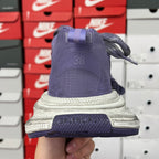 Dark blue knit sneaker sole view with BALENCIAGA branding on heel