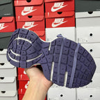 Dark blue knit sneaker outsole with raised tread pattern