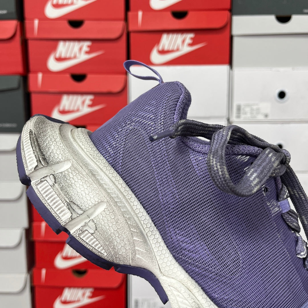 Dark blue knit sneaker with silver textured sole and side laces