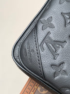 Louis Vuitton monogram bag, dark gray leather, side seam detail and embossed motifs