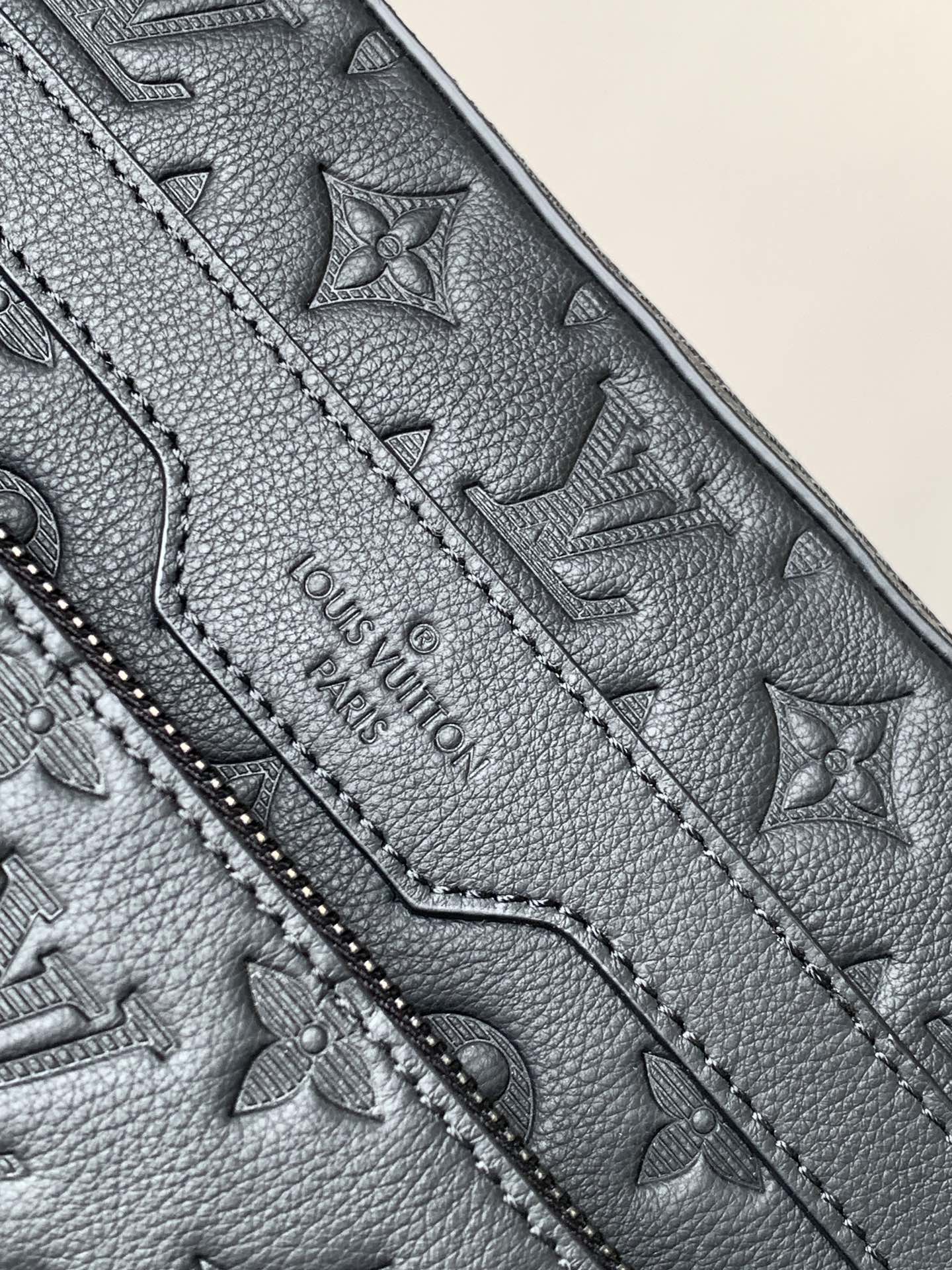 Louis Vuitton monogram bag, dark gray leather, logo embossing and stitched panel