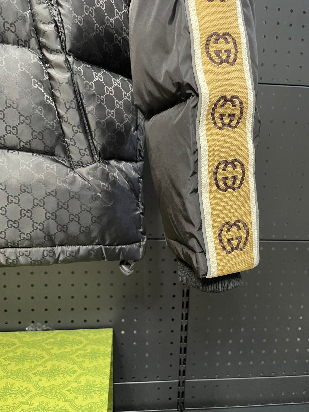 Quilted puffer jacket sleeve with Gucci logo stripe trim in yellow and black