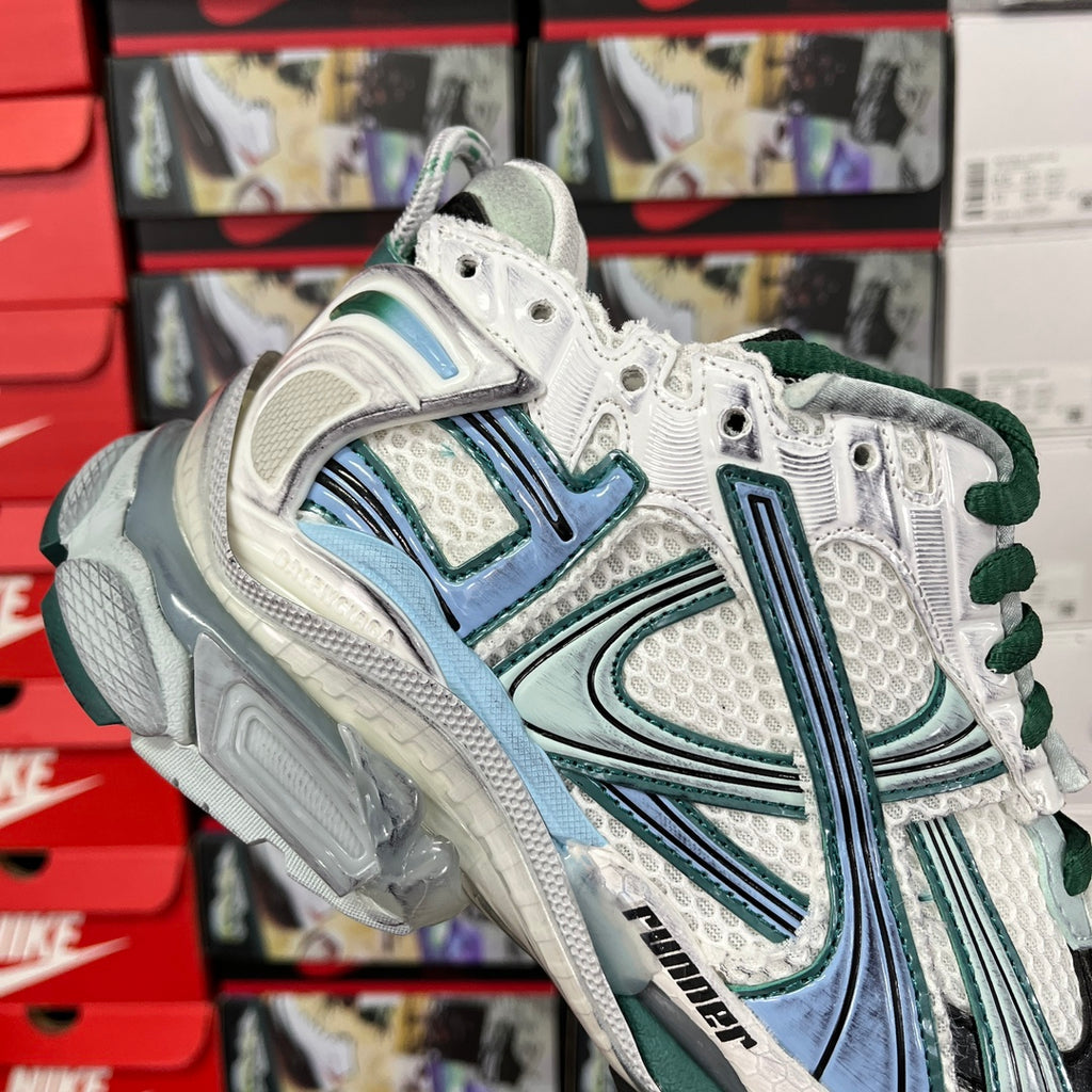 Balenciaga unisex running shoes, front 3/4 view with white mesh and teal graphic details