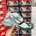 Balenciaga unisex running shoes, front 3/4 view with white upper, teal stripes and green laces