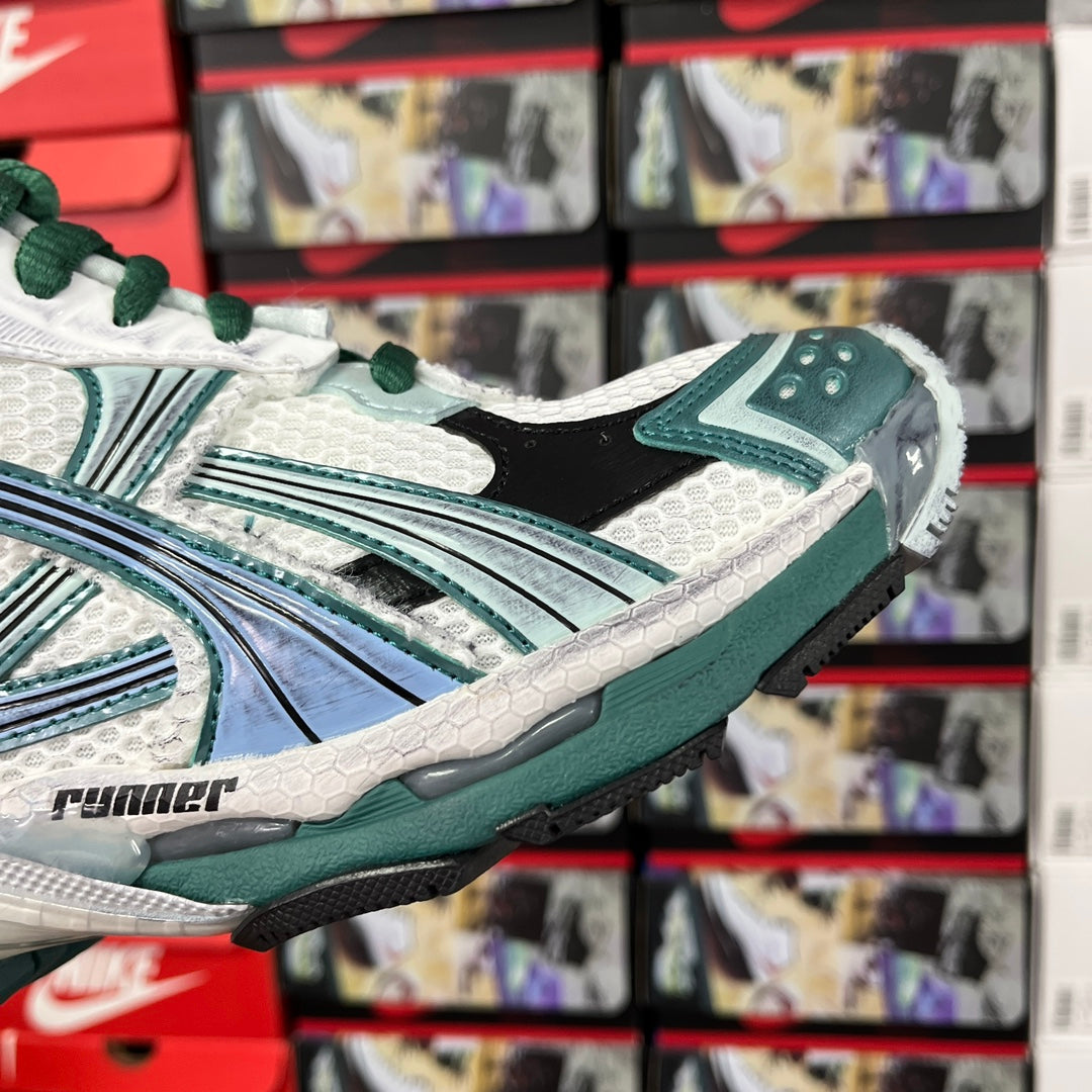 Balenciaga unisex running shoes, angled side view with teal sole and white upper, green laces