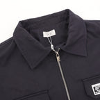 Dior jacket collar and zipper close-up with metal zipper pull and interior label