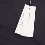 Dior jacket with two white hanging tags on inner upper back