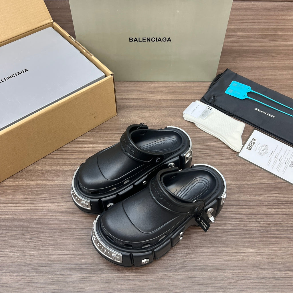 Black Balenciaga slide sandals with chunky platform sole and strap hardware