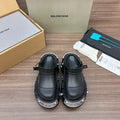 Black Balenciaga sandals with chunky studded platform sole and ankle strap details