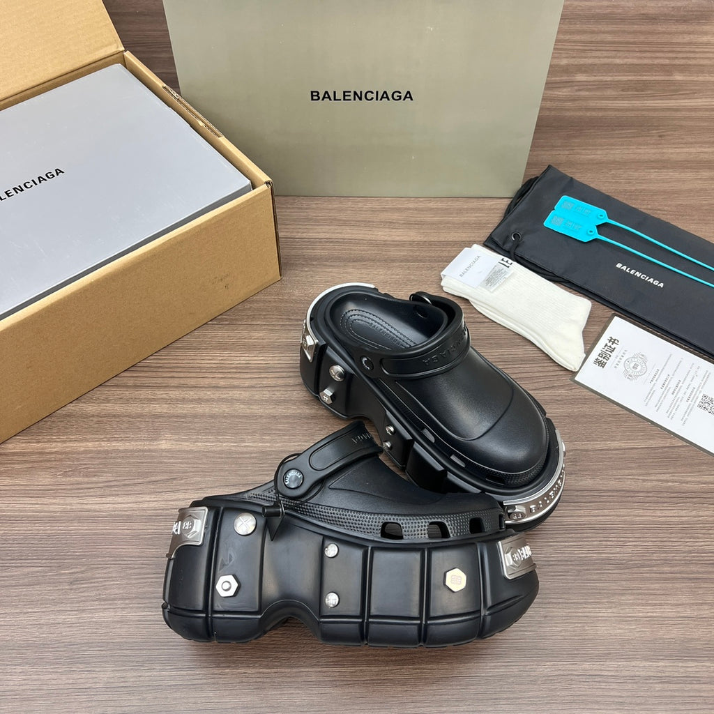 Black Balenciaga sandals with perforated upper panels and chunky sole with hardware