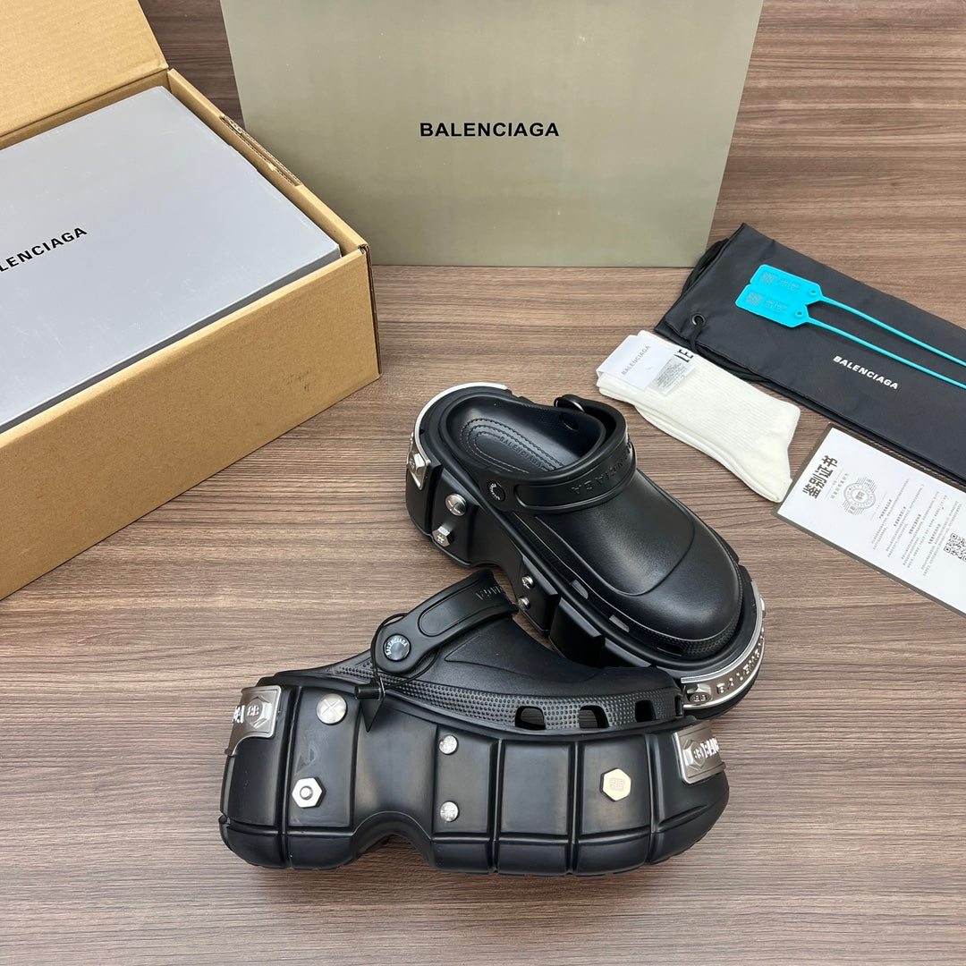 Black Balenciaga sandals with perforated upper panels and chunky sole with hardware