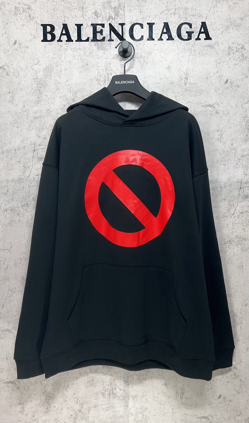 Balenciaga long hoodie, dark with red circle-and-slash logo and kangaroo pocket