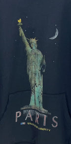 Balenciaga hooded sweatshirt detail: Statue of Liberty and "PARIS" text on front