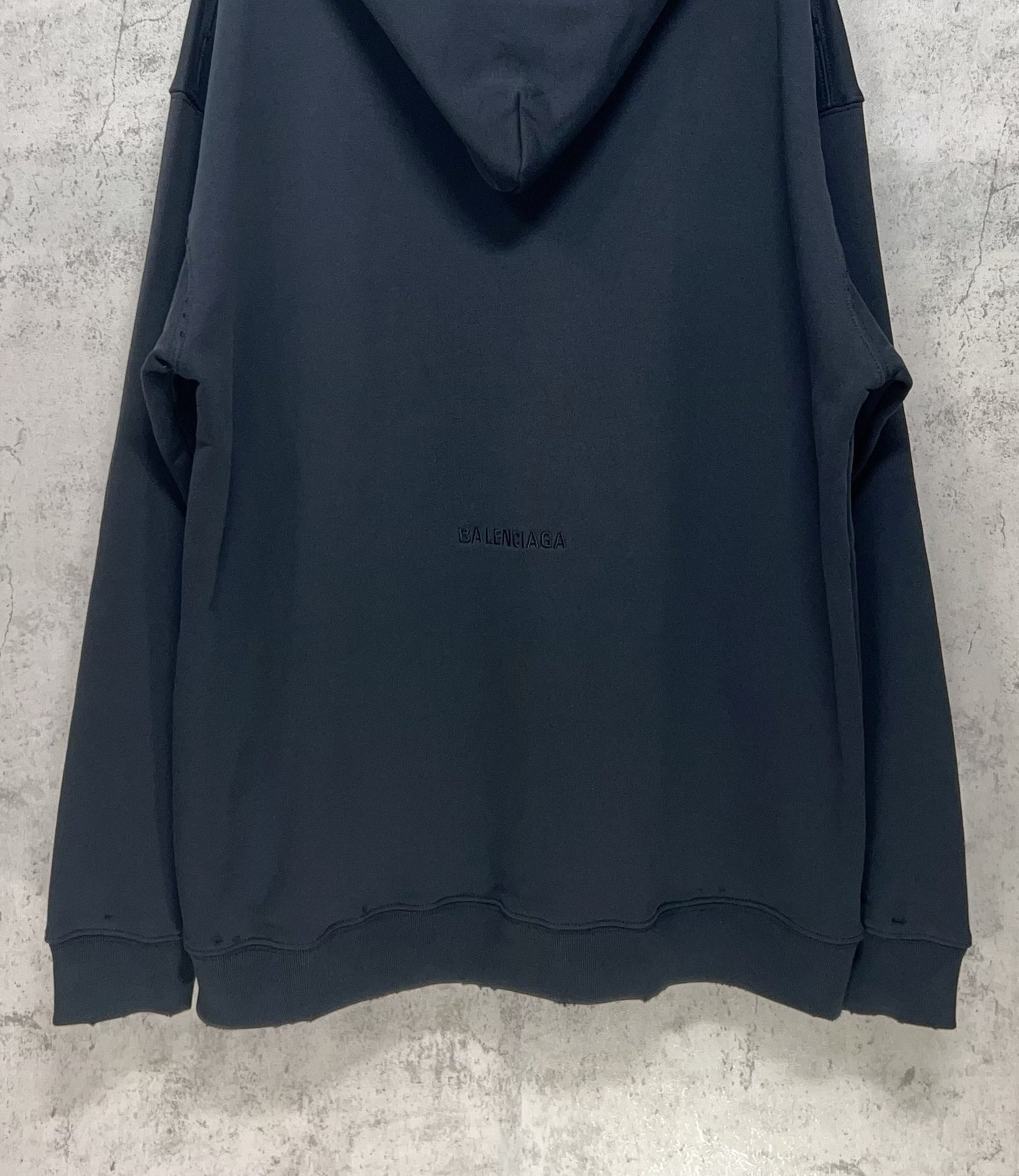 Balenciaga hooded sweatshirt, dark navy, back view with small center logo text