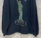 Balenciaga hooded sweatshirt detail: "PARIS" text and Statue of Liberty graphic