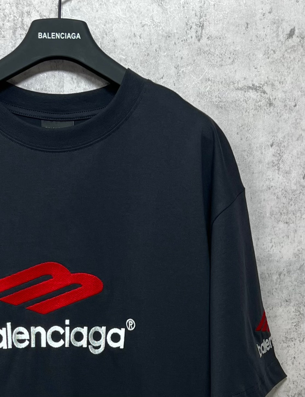 Balenciaga logo T-shirt, dark crewneck with red emblem and small sleeve print
