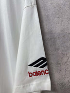 White short-sleeve T-shirt sleeve with small Balenciaga logo print near hem.