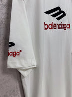 White short-sleeve T-shirt sleeve detail with partial Balenciaga logo.