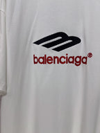 Close-up of Balenciaga logo print on white short-sleeve T-shirt.