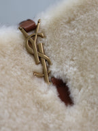 Cream shearling-look YSL bag with gold YSL hardware and brown leather tab