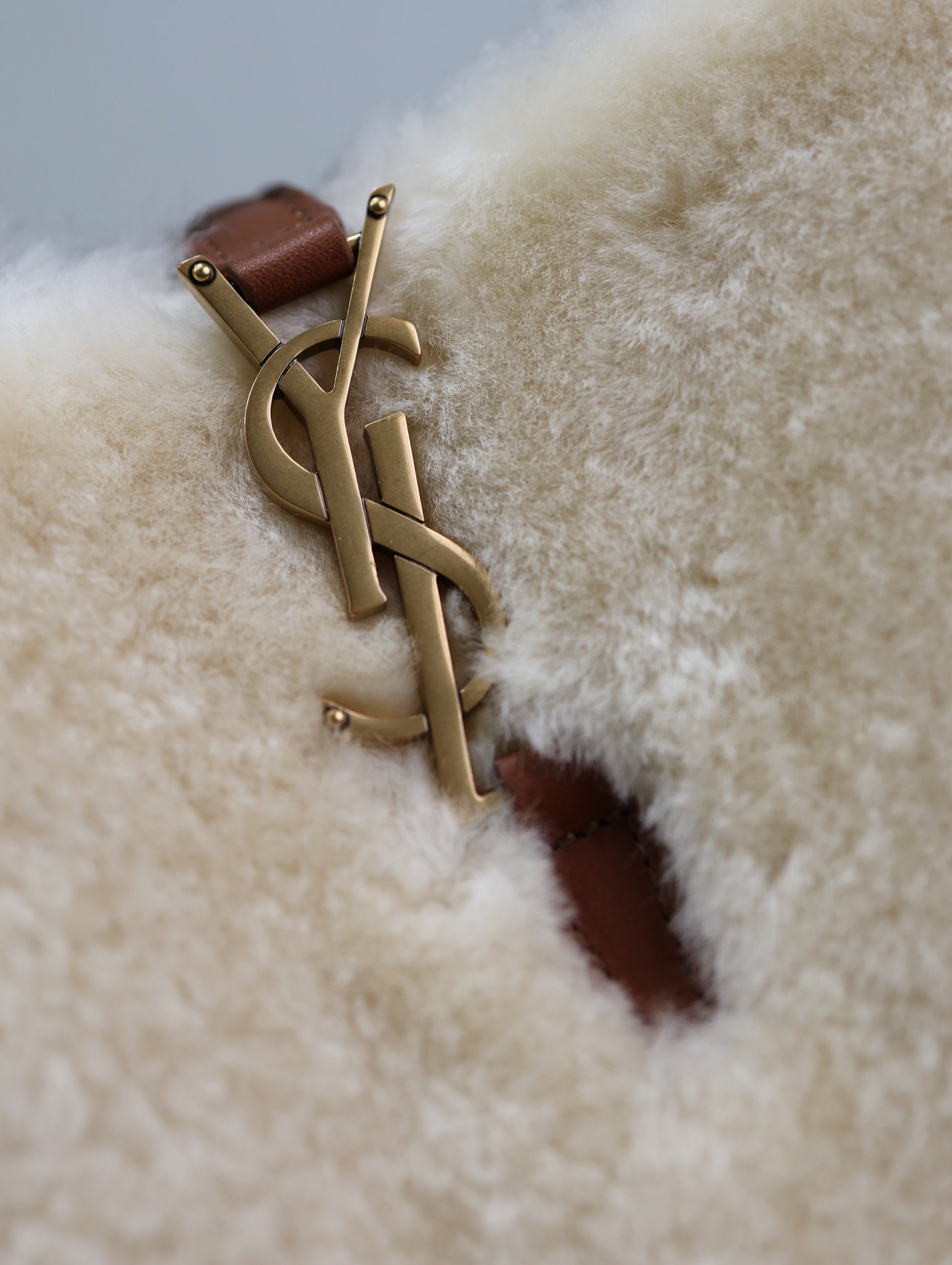 Cream shearling-look YSL bag with gold YSL hardware and brown leather tab