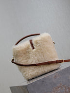 YSL faux fur mini bag with brown leather crossbody strap and front leather tab
