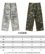 Camouflage cargo pants in light gray and green, with size chart print below