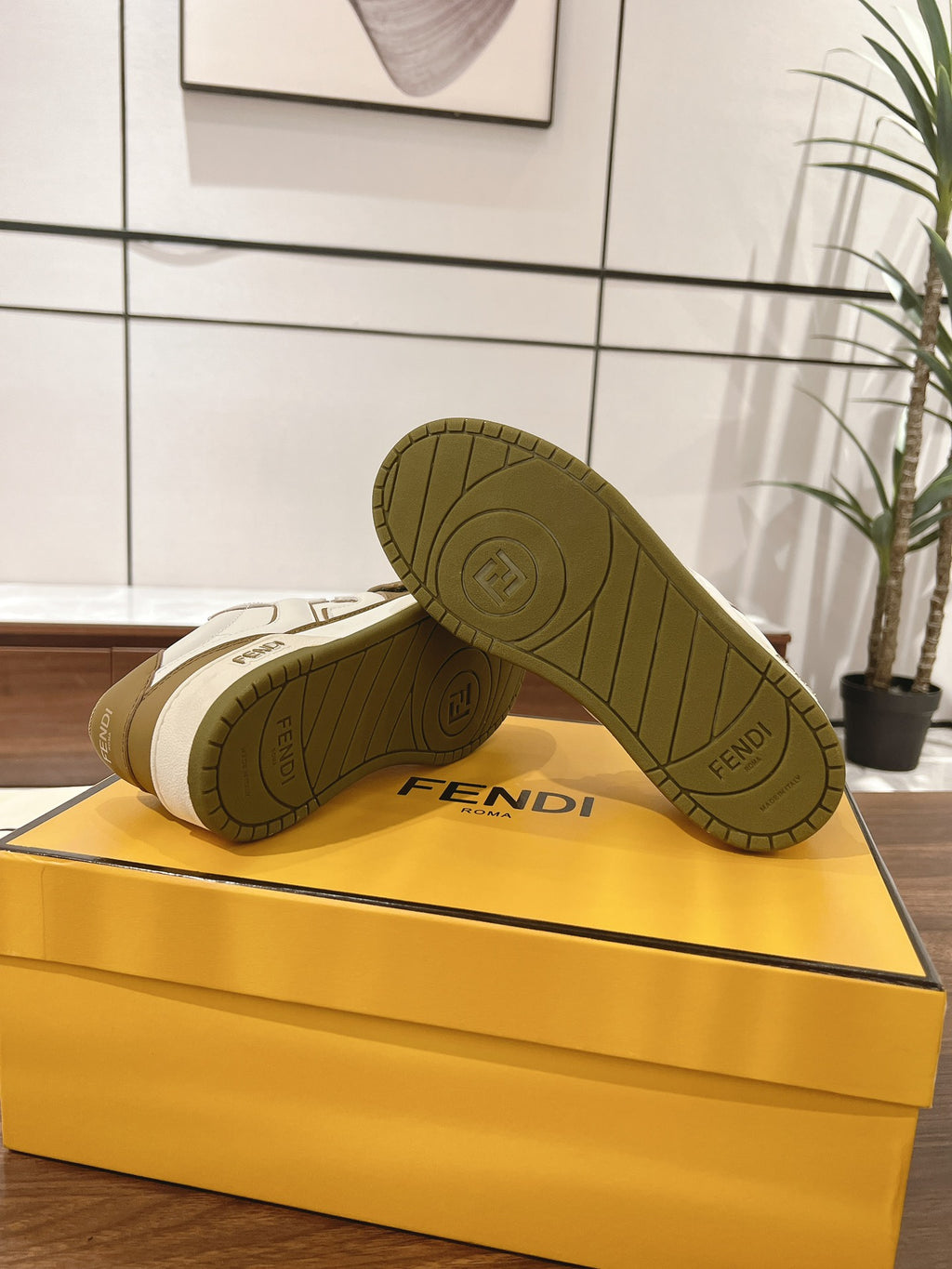 Fendi low-top sneakers outsole view on the box; tan tread with Fendi logo