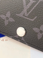 Small bag wallet close-up of round snap button on textured leather
