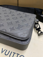 Men's Louis Vuitton gray monogram crossbody flap close-up with contrast trim