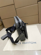Men's Louis Vuitton crossbody bag, gray monogram, side view with dual shoulder straps