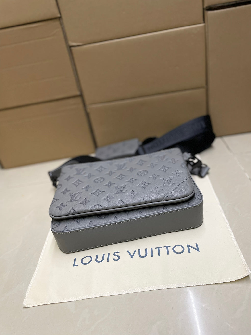 Men's Louis Vuitton crossbody bag, gray monogram, with top flap and shoulder strap