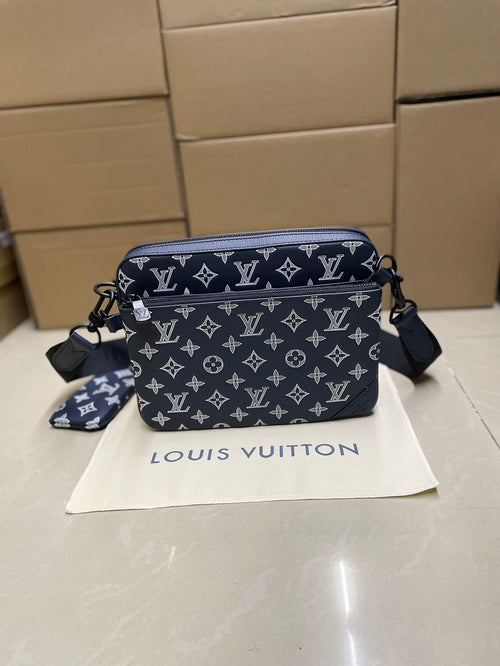 Men's Louis Vuitton crossbody bag, navy monogram with zip top and shoulder strap.
