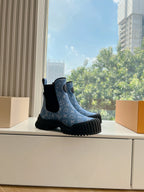 Blue patterned ankle Chelsea boots with black elastic panels and thick ribbed rubber soles