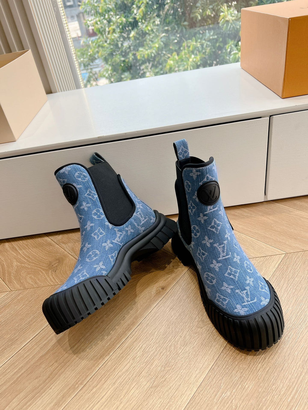 Blue monogram Chelsea boots with black elastic side inserts and grippy ribbed soles