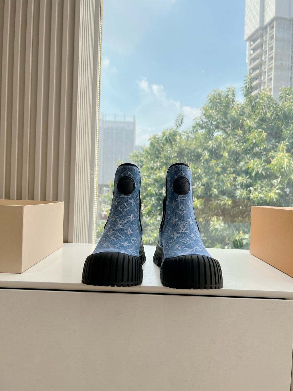Blue monogram ankle Chelsea boots with black elastic side panels and ribbed rubber soles