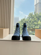 Blue monogram ankle Chelsea boots with black elastic side panels and ribbed rubber soles