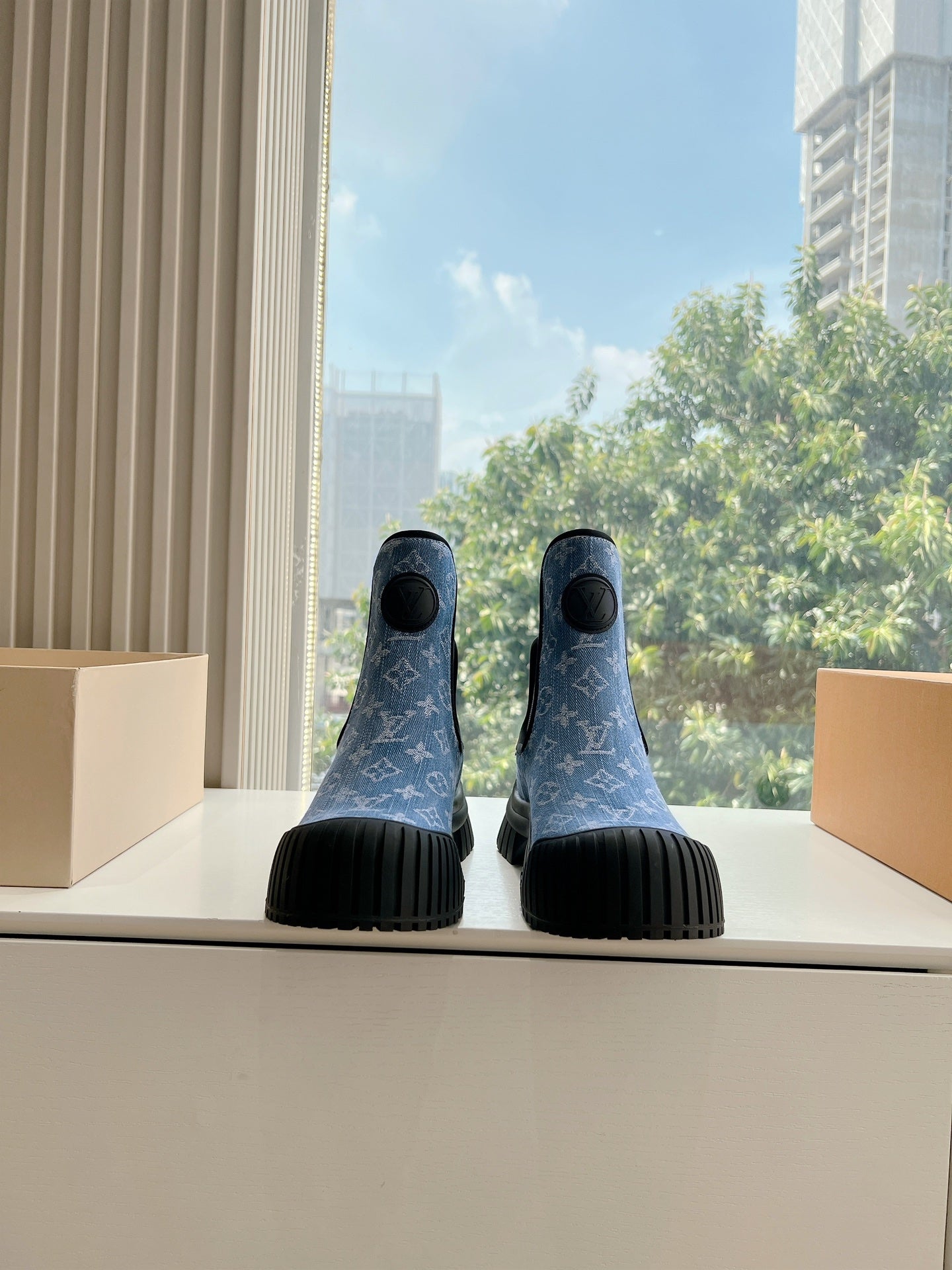 Blue monogram ankle Chelsea boots with black elastic side panels and ribbed rubber soles