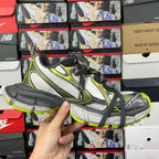 Balenciaga unisex sneakers front side view: white mesh, neon green edging, black laces