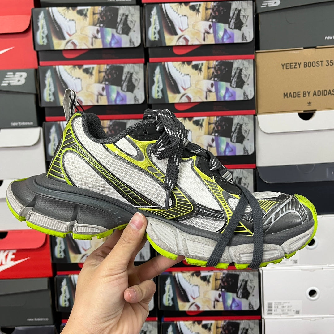 Balenciaga unisex sneakers front side view: white mesh, neon green edging, black laces