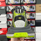 Balenciaga unisex sneakers heel view: black and white with neon green trim, size 42