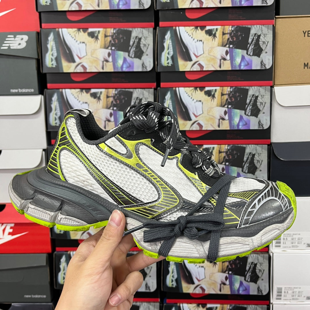 Balenciaga unisex sneakers with white mesh, neon green trim, black laces, chunky sole