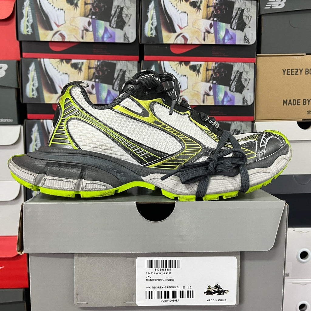 Balenciaga unisex sneakers on box: white mesh upper, neon green accents, black lace-up